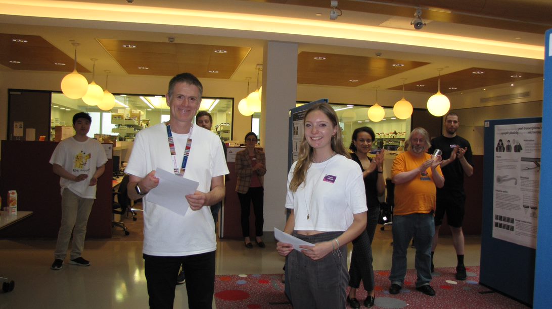 Professor Francis Barr awarding the best poster prize to Frances Spragge