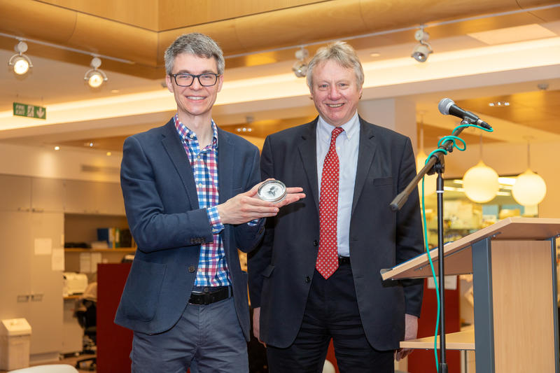 Associate Professor Stephan Uphoff receives his award from Professor Sir Alex Markham (Chairman) 