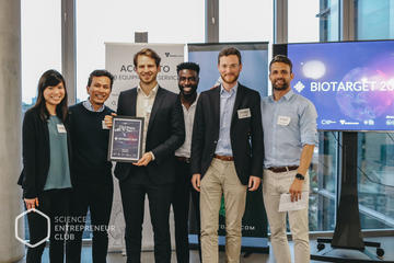 Sheryl, Irsyad and Arne (the three on the left) receiving the certificate of their prize